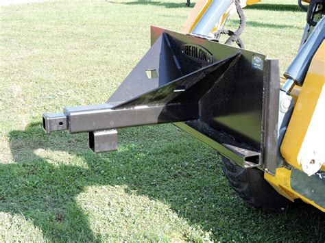 dump a trailer with skid steer|skid steer trailer moving attachment.